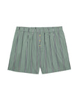The Stripe Pop Boxer by Donni features green cotton poplin with white and black vertical stripes, an elastic waistband, and button fly. These lightweight, breathable boxers are made in Los Angeles and shown laid flat on a white background.