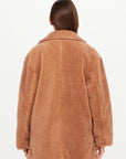 Brown teddy coat with plush texture, viewed from the back; The Upside GRACIE TEDDY COAT.
