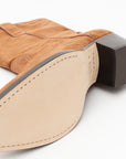 Close-up of the Winslow Boot by ONCEPT in tan suede. The light beige sole has visible stitching, while a dark brown stacked heel adds refinement. Crafted from premium materials, this boot is versatile for everyday wear.