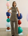 Hunter Bell NYC Juno Pants styled in a vibrant art gallery with bold, stacked sphere installations.