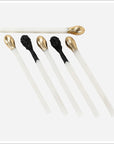 Six Matchstick Sculpture decorative accents with gold or black tips from Bungalow Furniture & Accessories.