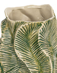 A close-up of the Bloomingville Green Floral Texture Vase, a round stoneware piece featuring green and cream palm leaf patterns and a wavy rectangular rim.
