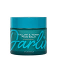 A teal jar labeled "Faire Tallow Face Balm | Natural Blue Tansy Skincare Moisturizer, 2 fl oz (60 mL)" features bold turquoise lettering and a matching lid—a soothing blue tansy balm for grass-fed tallow skincare.