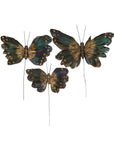 Set of 3 butterfly picks with black, green, and gold wings on wires by Faire Moody for decorative accents.
