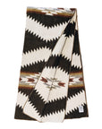 Folded chocolate Tsachila blanket by Bungalow Furniture & Accessories featuring a brown and cream geometric zigzag pattern.
