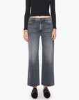 The Dodger Flood high-waisted slouchy jeans by Mother styled with a black crop top and loafers.