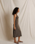 Edith Heavy Rib Midi Tank Dress by Perfectwhitetee in cream, ribbed texture, shown in profile against fabric backdrop.