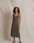 Edith Heavy Rib Midi Tank Dress by Perfectwhitetee in cream, styled casually with flip-flops against fabric backdrop.