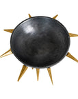 The Import Collection's Punk Centerpiece is a black, matte-finish metal bowl with gold sunburst spikes around the rim, offering industrial chic style—shown on a white background.