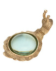Kasden snail-shaped magnifying glass in gold-toned textured metal for a desk accessory.