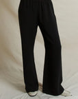 Black wide-leg high-waisted crepe pull-on trousers from the Bungalow Furniture & Accessories Georgia Crepe Pant collection.