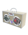 The Faire Gold Bling Wireless Boombox with FM Radio features a fabric-like beige exterior, two large LED light-up speakers with silver rims, a central blue-lit control knob, a silver handle on top, and displays "BL UE".
