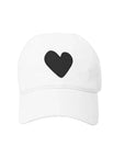 The Kerri Rosenthal Baseball Hat Heart Patch is a plain white cap featuring a bold black heart embroidered at the front, inspired by popular designs.