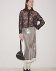 Metallic silver sequin Jupe Skirt by Roseanna worn with a black lace button-up shirt.
