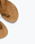 Close-up of the Freda Salvador KAT tan suede heeled thong sandals with a minimalist design, photographed from above on a plain white background.