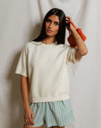 Perfectwhitetee Kennedy SS Crew Sweatshirt styled with striped shorts and orange bag, white background.