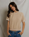 Beige Perfectwhitetee Kennedy SS Crew Sweatshirt styled with blue jeans, casual look against fabric backdrop.