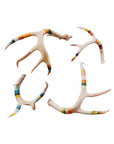 Four whitetail deer antlers wrapped in multicolored wool and copper wire, handcrafted by Bungalow Furniture & Accessories.
