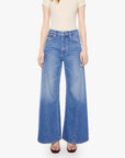 Mother’s Lil Lemon Twist Skimp jeans in light wash, slim fit, modeled against a plain white background.