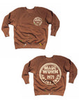 Two images of the Made Worn Madeworn Shrunken Sweatshirt, a brown USA-made crewneck with paint splatters, a small circular "MADE WORN 1971 ARTIST TOUR" logo on the chest, and a larger version on the back.
