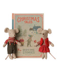 Maileg Christmas twin mice in festive red and green clothing posed in front of a Christmas Tales storybook.