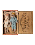 Maileg Mum & Dad Mice by Maileg come in a vintage-style "CIGARS" box bed. Dressed in pajamas and sleep masks, Mum wears a white dress with orange dots, Dad wears blue striped pajamas.