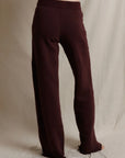 Wide-leg fleece pants by Perfectwhitetee styled casually in a neutral, modern setting.