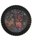 Round black fluted vanity tray with vibrant floral design by Faire, perfect for adding color to your bathroom or bedroom.