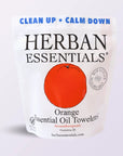 A white pouch labeled "Faire Orange Towelettes - 20 Individual Essential Oil Wipes" with a large orange graphic. Each wipe is infused with orange essential oil and comes individually wrapped. Features “CLEAN UP • CALM DOWN” and “New Recycled & Recyclable Bags.”.