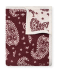Reversible burgundy throw with white paisley, cream border, by Faire Palmer Paisley for Bungalow Furniture & Accessories.