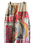 Ping Pong Surf Club’s Aloha Paradise Jogers feature vibrant red and orange "ALOHA" and "PARADISE" prints, surfers, waves, and palm trees—bringing bold Hawaii vibes and island comfort to your summer style.