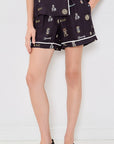 Sea New York Juliet patterned shorts in a relaxed fit, styled with black woven shoes, set against a white background.
