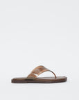The Rag & Bone gracie jelly thong, a brown sandal with a flat sole and glossy wide strap, features a geometric square toe and is displayed against a plain white background.
