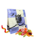 Faire Spooky Gummy Mix bag featuring skull and worm shapes with a pile of loose Halloween candy.