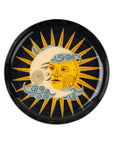 The Indaba Sun and Moon Tray features a yellow sun with a face partly covered by a crescent moon, both set among blue clouds on a dark background—a unique accent decor piece.