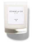 The 14 OZ Classic Highball by Voyage Et Cie is a white soy coconut blend candle in a clear glass jar with a "VOYAGE ET CIE est. 2005 LONDON THÉ" label—an elegant, sustainable organic addition to your collection.