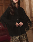 Western Fringe Sweater Jacket by The Great Inc., styled with a leopard skirt, indoors with a relaxed vibe.