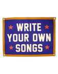Blue Faire flag with orange trim and red stars, Write Your Own Songs motif, whimsical decor by Bungalow Furniture.