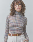 SUNCOO Manech check-print tee and high-waisted pants in a casual style, modeled against a plain backdrop.