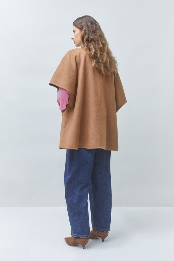 SUNCOO Ezra front-buttoned coat in pink with blue jeans, shown from the back against a light background.