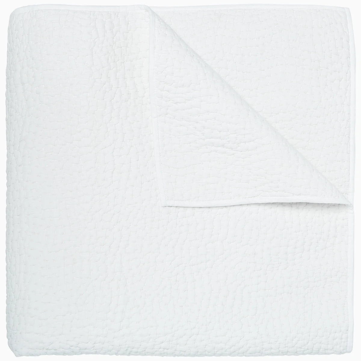 The John Robshaw Hand Stitched Coverlet King, neatly folded with a corner turned down, showcases its soft, lightweight cotton voile and subtle stitched pattern.