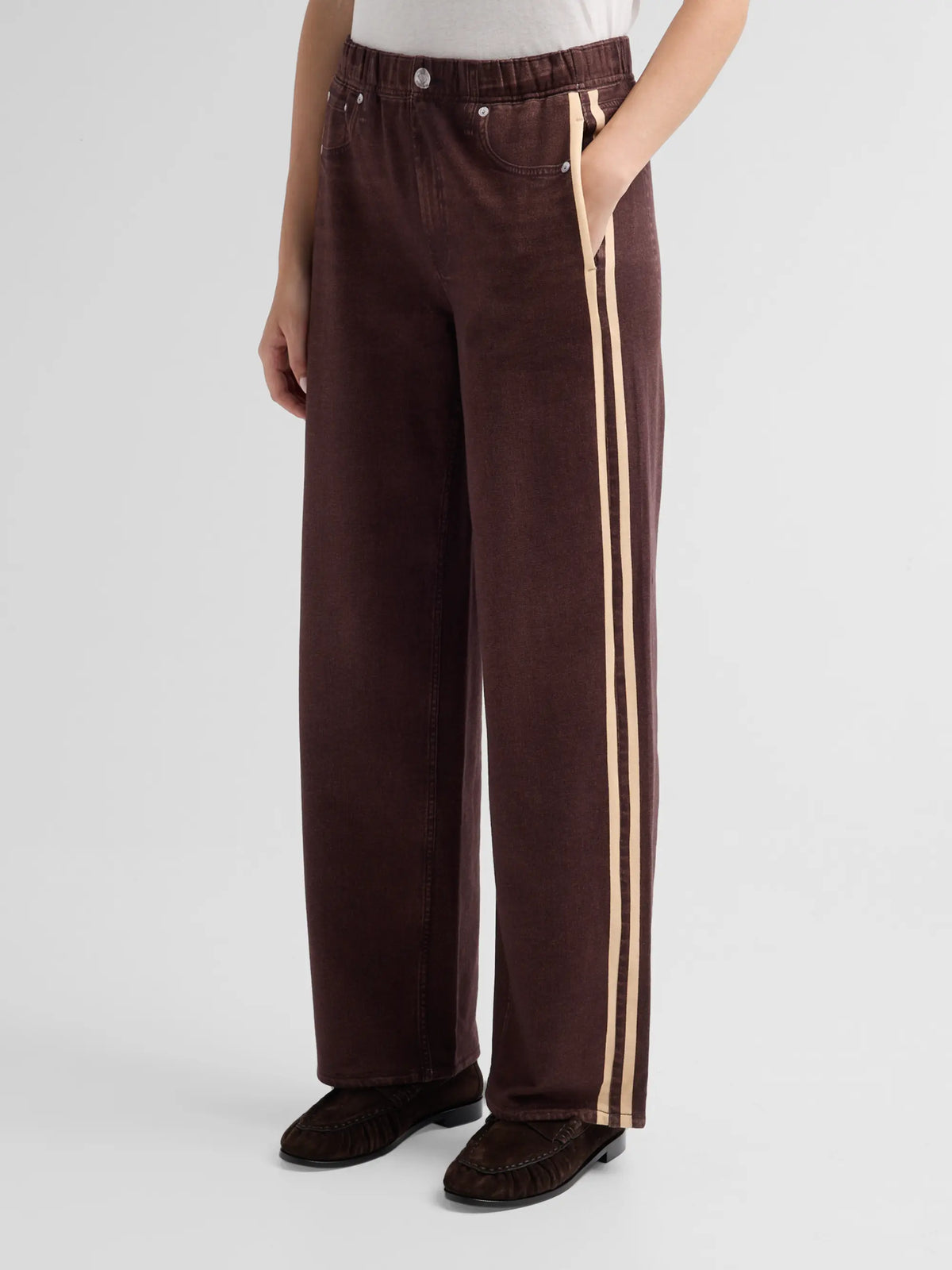 Brown wide-leg rb miramar terry track pull-on jeans with light side stripes and button detail.