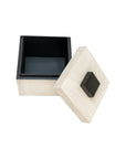 The Import Collection’s 46-056 Foley Box is a small, square wooden box with a black interior and matching lid with black square handle—ideal as a decorative storage piece for modern homes.