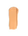 A swatch of Faire's Moisturizing Tinted Serum is smeared vertically in a rectangular shape on a white background.