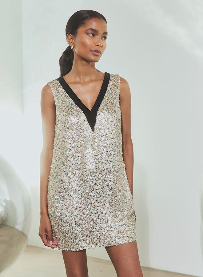 Metallic sequined mini dress with black V-neck trim from Hunter Bell NYC, perfect for holiday celebrations.