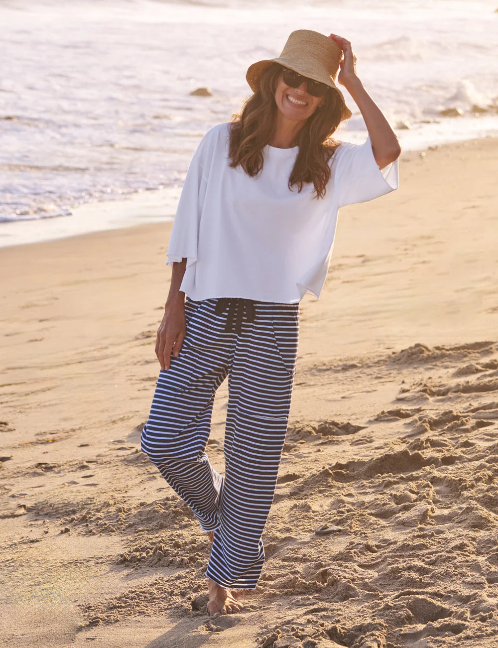 Frank & Eileen Presley Oversized Tee in white, casual beachwear style, worn barefoot by the water.