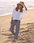 Frank & Eileen Presley Oversized Tee in white, casual beachwear style, worn barefoot by the water.