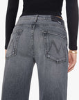 Gray slouchy jeans from Mother’s The Dodger Flood, seen from the back, paired with a black long-sleeve top.