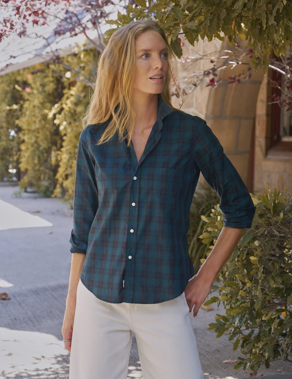 Barry Tailored Button Up Shirt by Frank & Eileen in white, styled outdoors against lush greenery.
