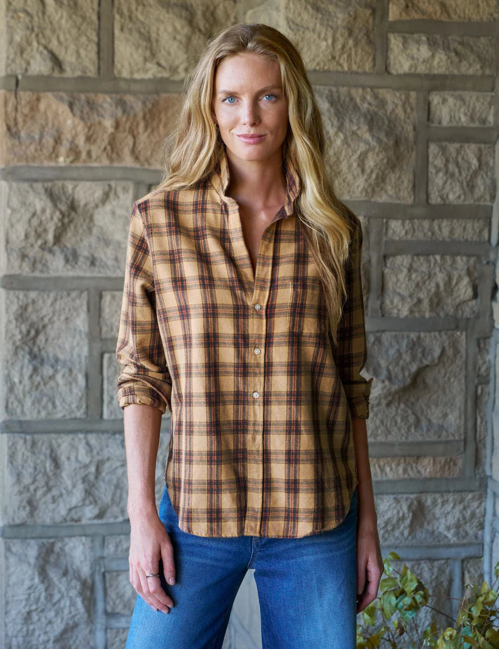 Frank & Eileen Eileen 26 shirt and jeans styled casually by a stone wall, capturing relaxed California vibes.